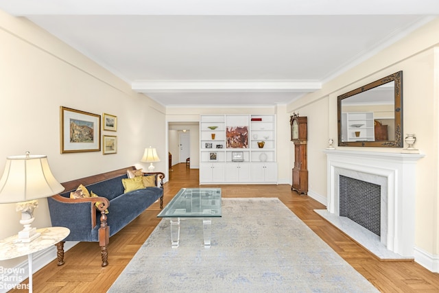 living room featuring baseboards, a fireplace with flush hearth, beam ceiling, and crown molding