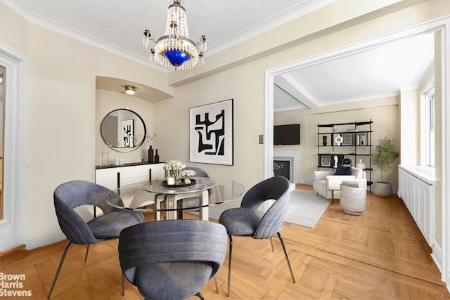 living area with beam ceiling, a fireplace, a chandelier, and crown molding