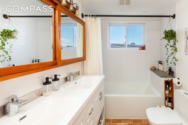 bathroom with toilet, shower / bathtub combination with curtain, double vanity, and a sink