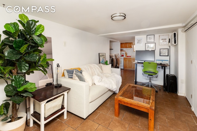 living room featuring washer and clothes dryer