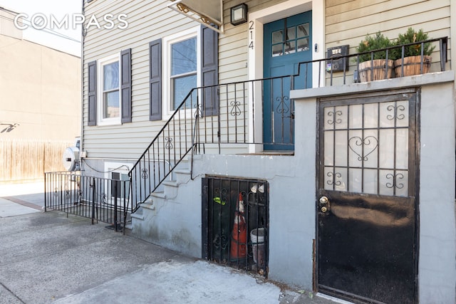 view of exterior entry with fence