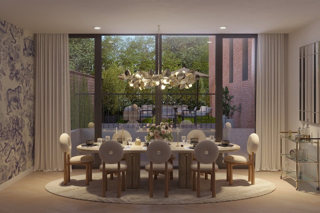 dining room with a notable chandelier and wallpapered walls