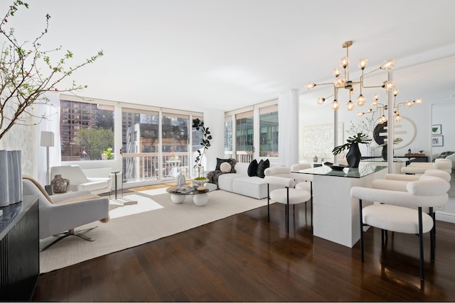 living area with a notable chandelier and wood-type flooring