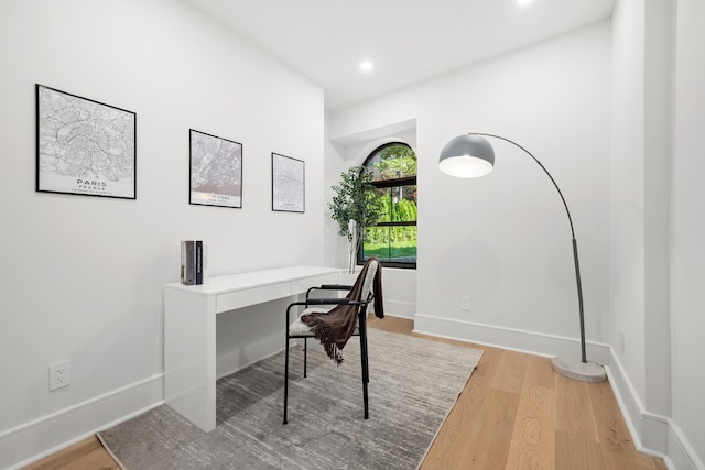 home office with recessed lighting, wood finished floors, and baseboards