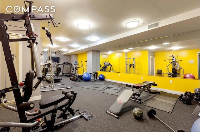 gym with baseboards and visible vents