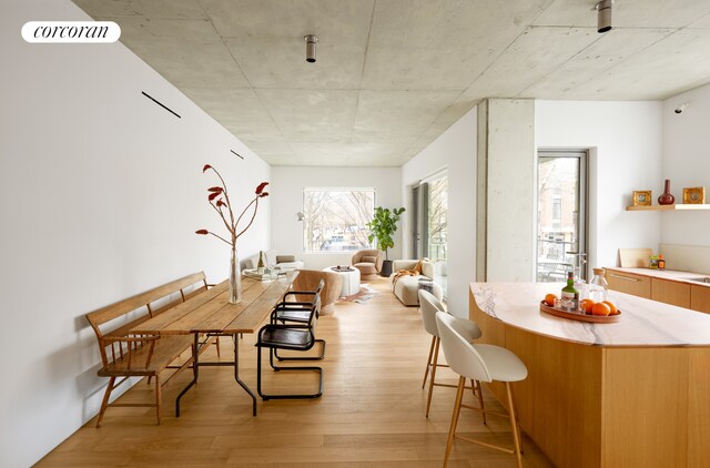 dining area featuring visible vents and light wood-style floors