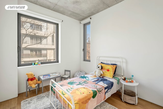 bedroom featuring wood finished floors