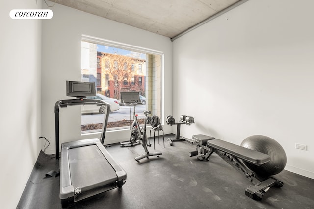 workout area featuring baseboards