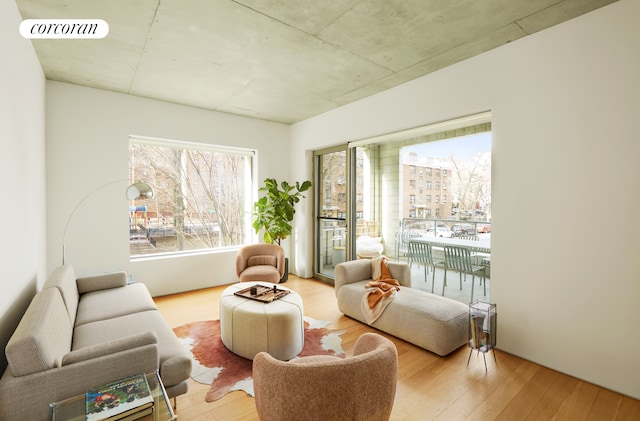 living area with wood finished floors and visible vents