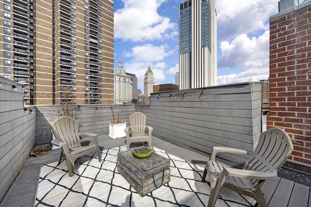 exterior space featuring a city view and fence