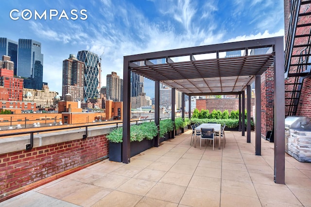 view of patio with a view of city, outdoor dining area, grilling area, and a pergola