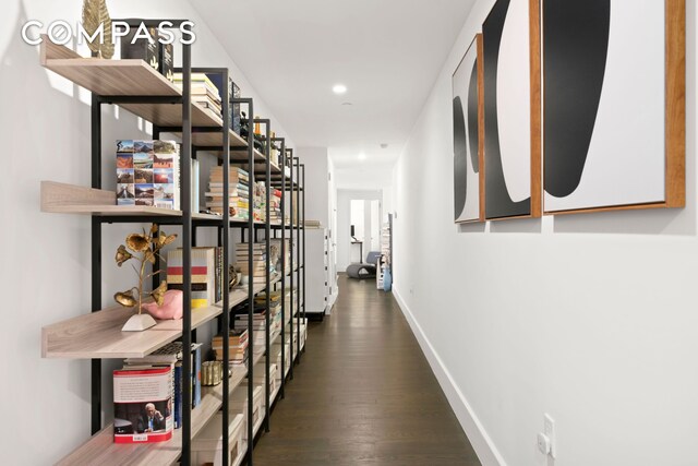 hall with dark wood-style floors, recessed lighting, and baseboards