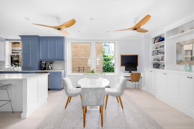 dining room with light wood finished floors, ceiling fan, built in features, and recessed lighting