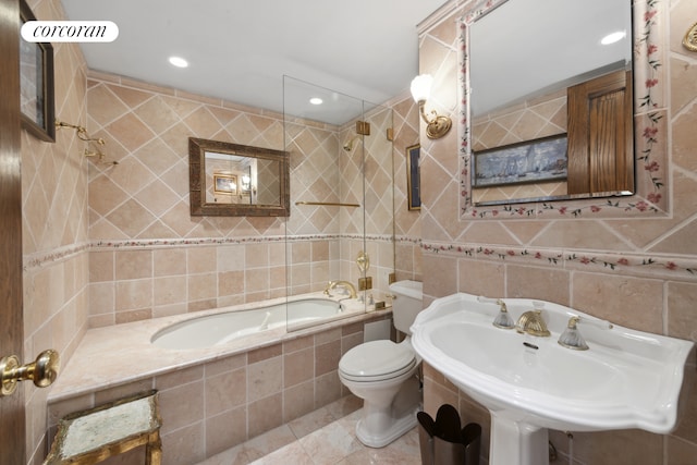 bathroom with toilet, recessed lighting, tile walls, and tile patterned floors