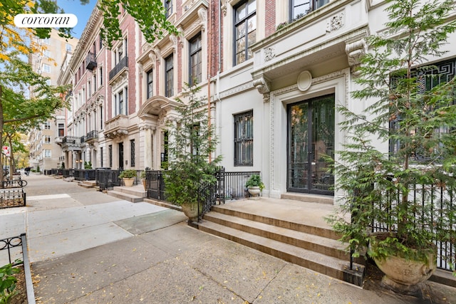 entrance to property with a residential view and brick siding