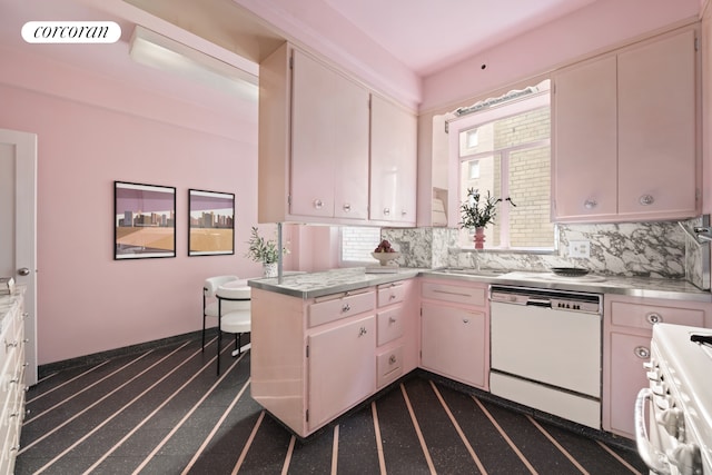 kitchen with tasteful backsplash, white appliances, visible vents, and a peninsula