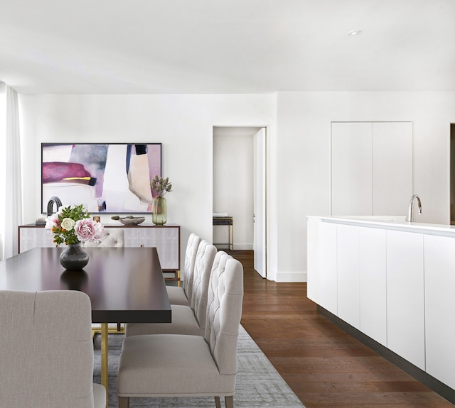 dining area featuring dark wood-style floors