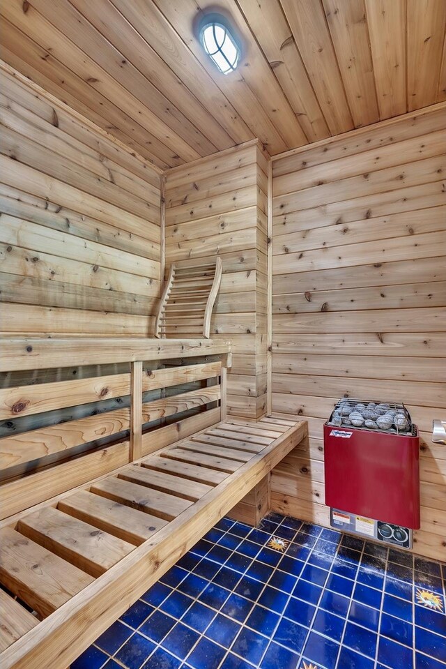 91-16 Shore Front Pkwy Unit 6H, New York City, NY 11693 - relaxing sauna with tile patterned floors, wooden ceiling, and wood walls