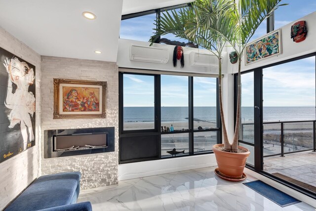 91-16 Shore Front Pkwy Unit 6H, New York City, NY 11693 - interior space with a water view, a wall unit AC, marble finish flooring, recessed lighting, and healthy amount of natural light