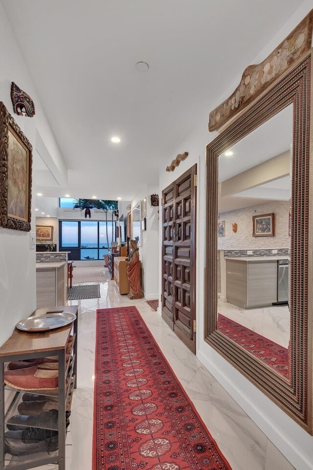 91-16 Shore Front Pkwy Unit 6H, New York City, NY 11693 - corridor featuring light marble finish floors and recessed lighting