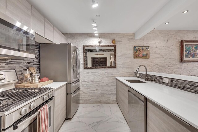 91-16 Shore Front Pkwy Unit 6H, New York City, NY 11693 - kitchen featuring stainless steel appliances, modern cabinets, a sink, light countertops, and beamed ceiling
