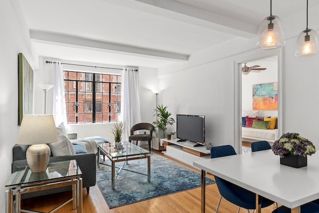 325 E 41st St Unit 806, New York City, NY 10017 - living area featuring wood finished floors and beamed ceiling