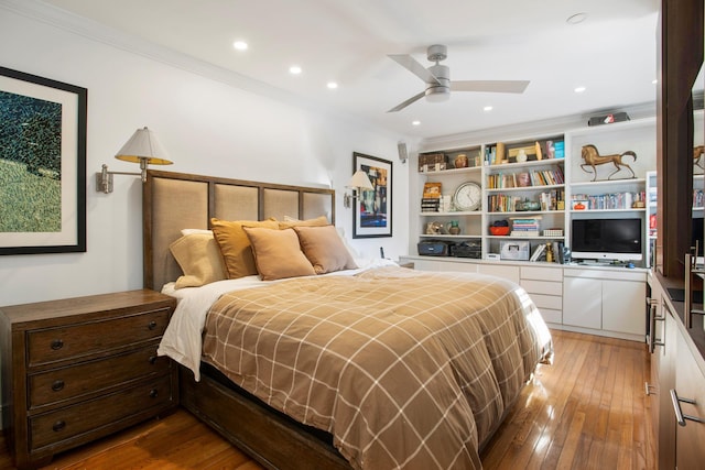 bedroom featuring ornamental molding, recessed lighting, ceiling fan, and hardwood / wood-style floors