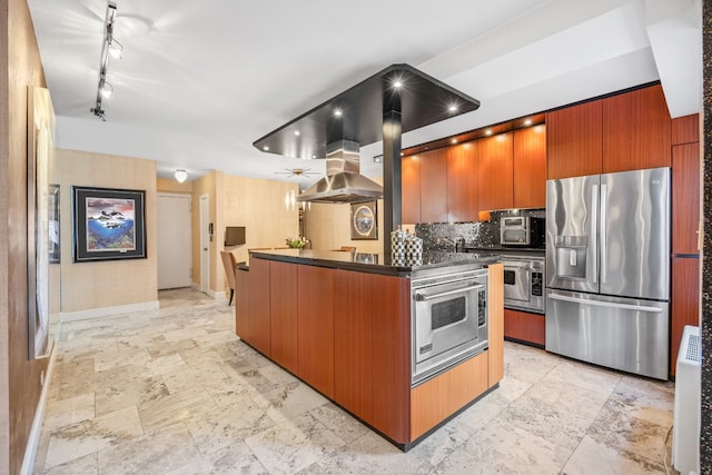 75 E End Ave Unit 19C, New York City, NY 10028 - kitchen with appliances with stainless steel finishes, dark countertops, modern cabinets, track lighting, and baseboards