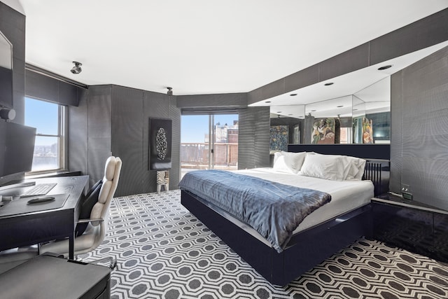 75 E End Ave Unit 19C, New York City, NY 10028 - bedroom featuring multiple windows and carpet flooring
