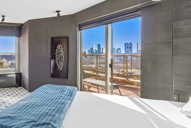 75 E End Ave Unit 19C, New York City, NY 10028 - bedroom featuring a skyline view and multiple windows