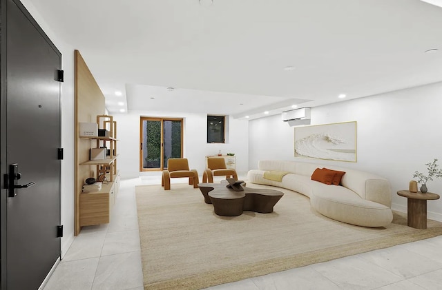 living area featuring light tile patterned flooring, recessed lighting, a wall mounted air conditioner, and baseboards