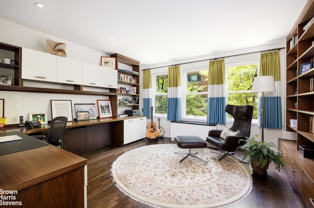 home office featuring recessed lighting, dark wood finished floors, and built in desk