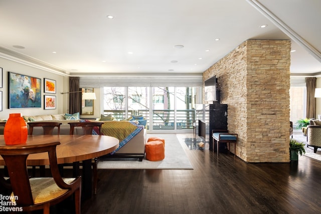 dining space featuring recessed lighting, crown molding, and wood finished floors