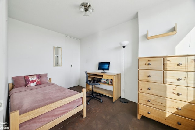 bedroom featuring dark floors