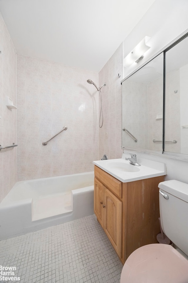 full bathroom featuring shower / tub combination, vanity, toilet, and tile patterned floors