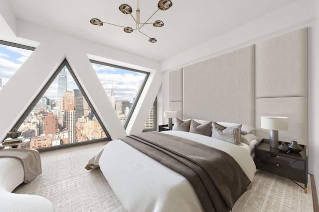 bedroom with a chandelier and a city view