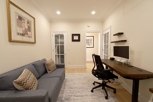 office space with recessed lighting, crown molding, light wood-style flooring, and baseboards