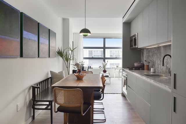 dining area with wood finished floors