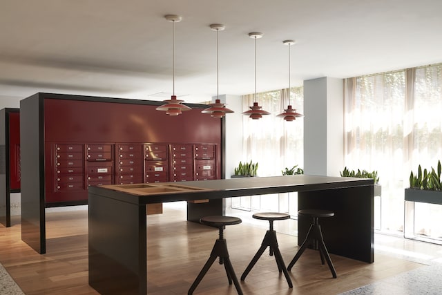 bar with a wall of windows, pendant lighting, mail area, and wood finished floors