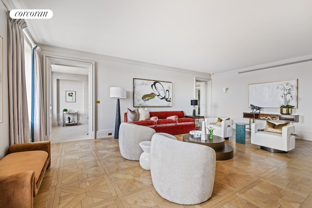 living room featuring ornamental molding and baseboards