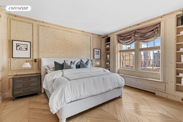 bedroom featuring visible vents and a city view