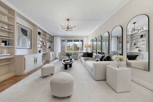 living area featuring built in features, ornamental molding, and a notable chandelier