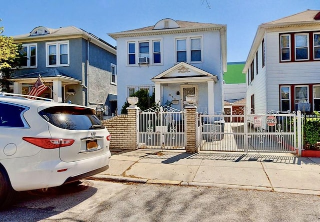 view of front of house featuring a gate and fence