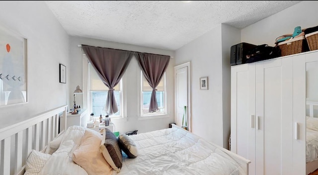 bedroom featuring a textured ceiling