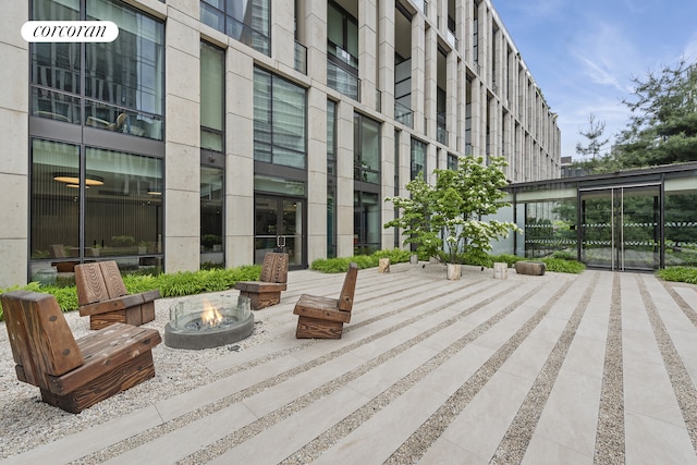 view of property's community featuring a fire pit