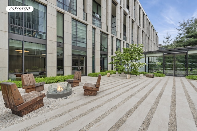 surrounding community with a fire pit
