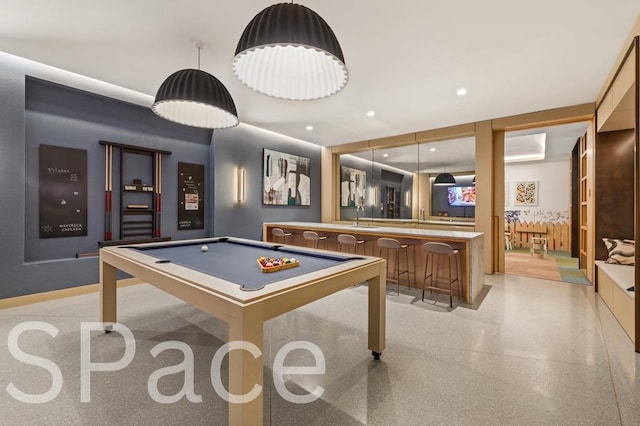 215 W 28th St Unit 14C, New York City, NY 10001 - game room with billiards, wet bar, and dark aggregate flooring