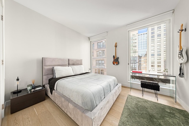 215 W 28th St Unit 14C, New York City, NY 10001 - bedroom with wood finished floors and baseboards