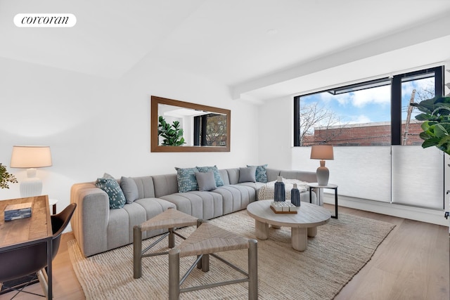 living room featuring light wood-type flooring and visible vents