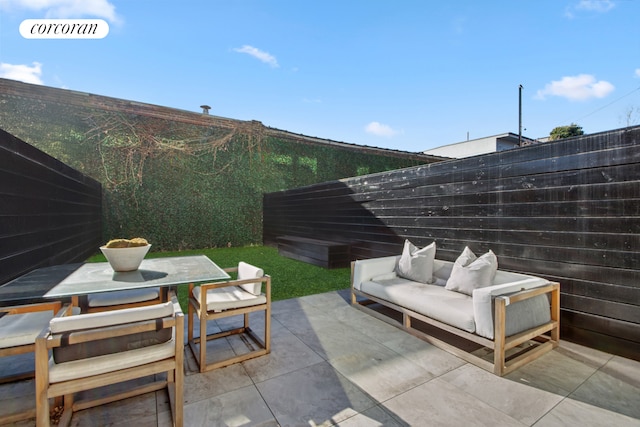 24 Huntington St, New York City, NY 11231 - fenced backyard with outdoor lounge area, a patio, and outdoor dining space